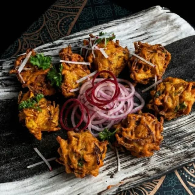 Onion bhajia Indian fritter at Sula Davie Street