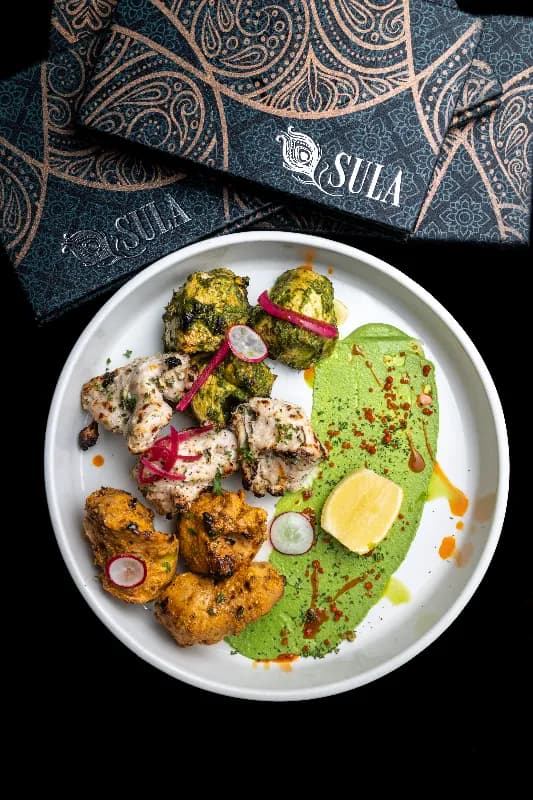 Tandoori chicken tikka marinated in Kashmiri chili at Sula Commercial Drive