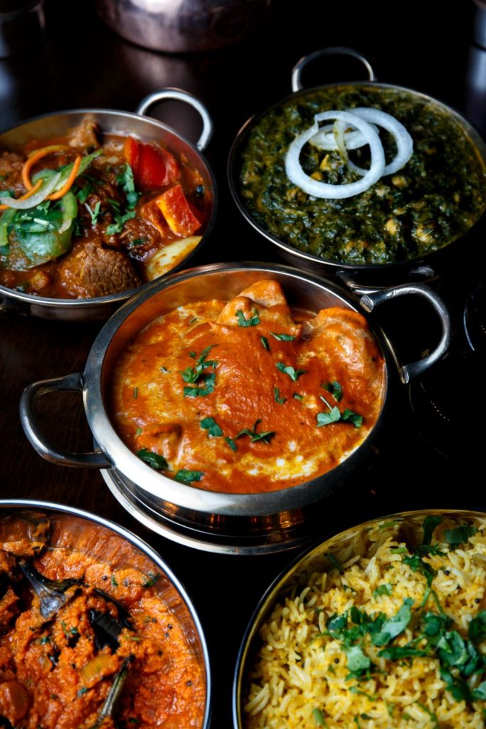 Rich and creamy Butter Chicken, a classic Indian curry, served at Sula Indian Restaurant