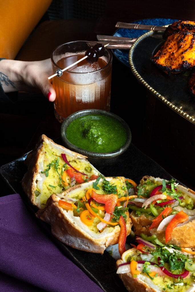 Two crispy vegetarian samosas.