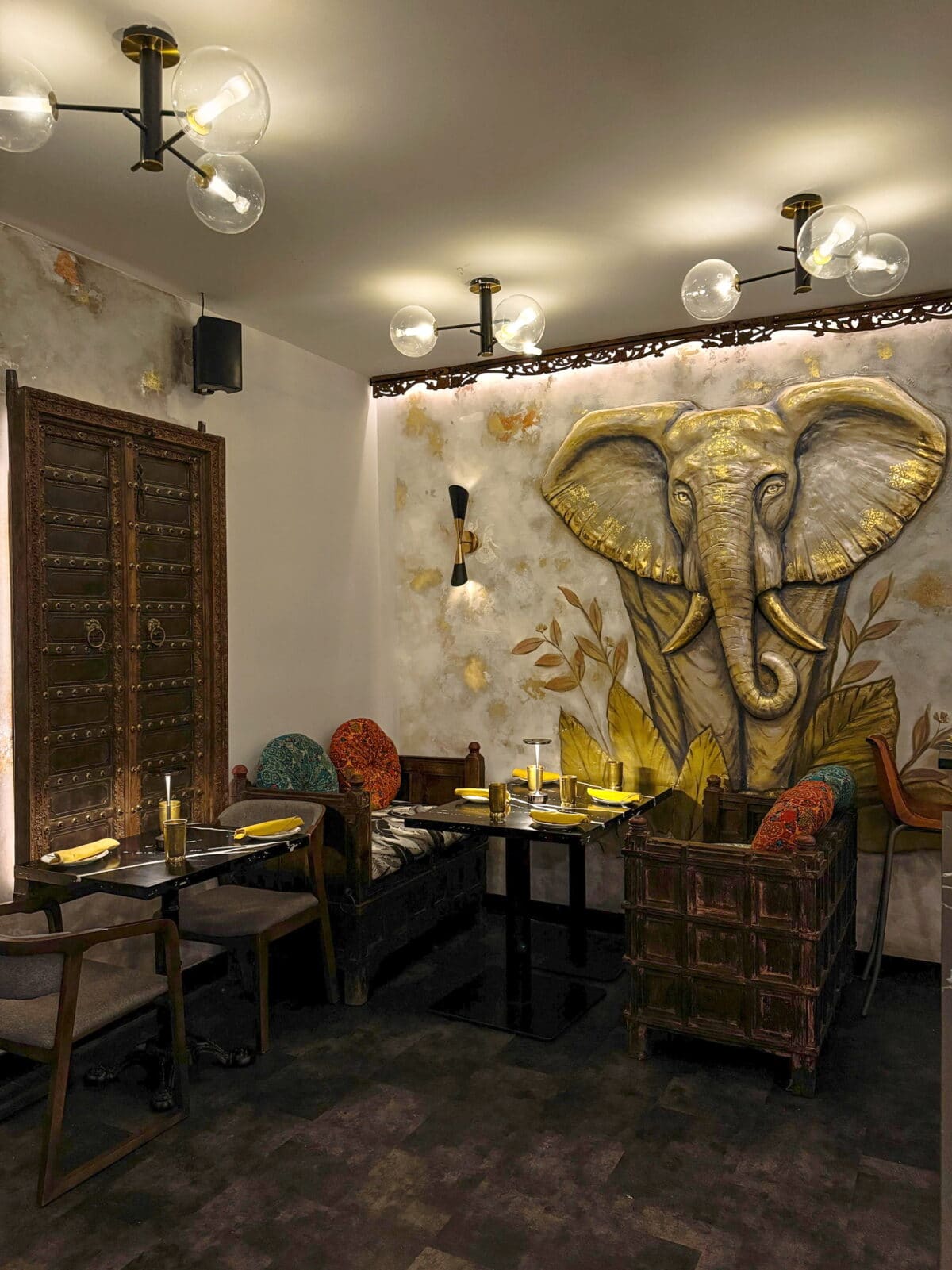Warm and cozy seating arrangement at Sula Commercial Drive's interior.