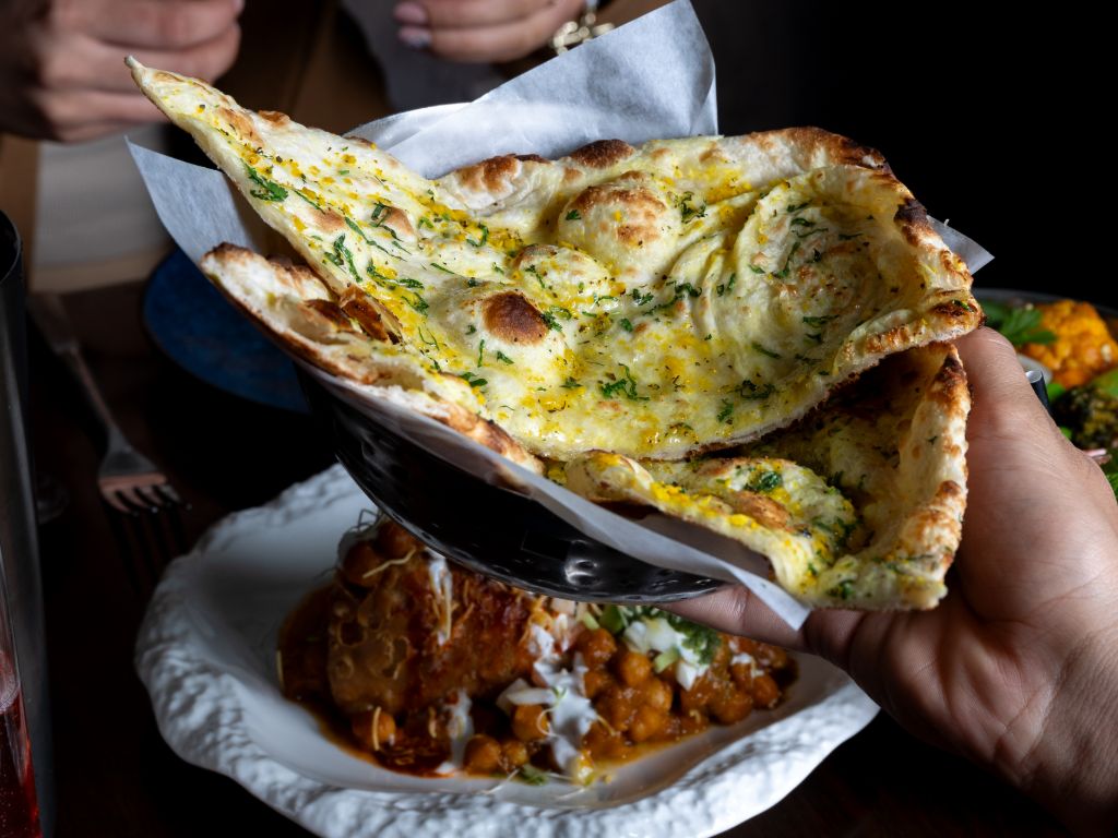 Garlic Naan at Sula Fluffy garlic naan brushed with butter served hot at Sula Indian Restaurant