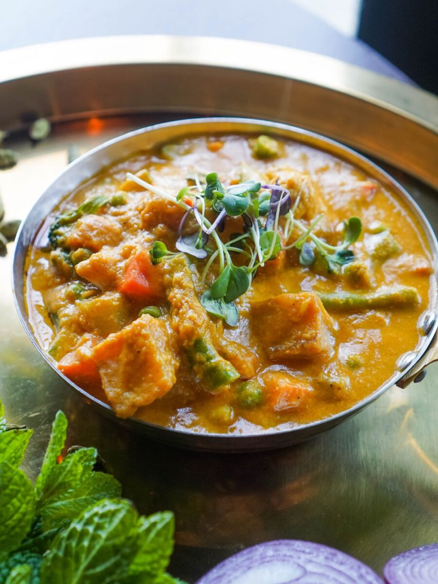 Creamy Vegetable Coconut Curry Indian Vegan Dish at Sula Commercial Drive