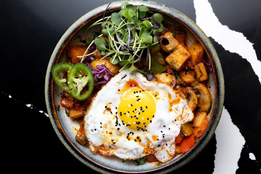 Vindaloo egg bhurji and Indian bennies at Sula weekend brunch in Vancouver