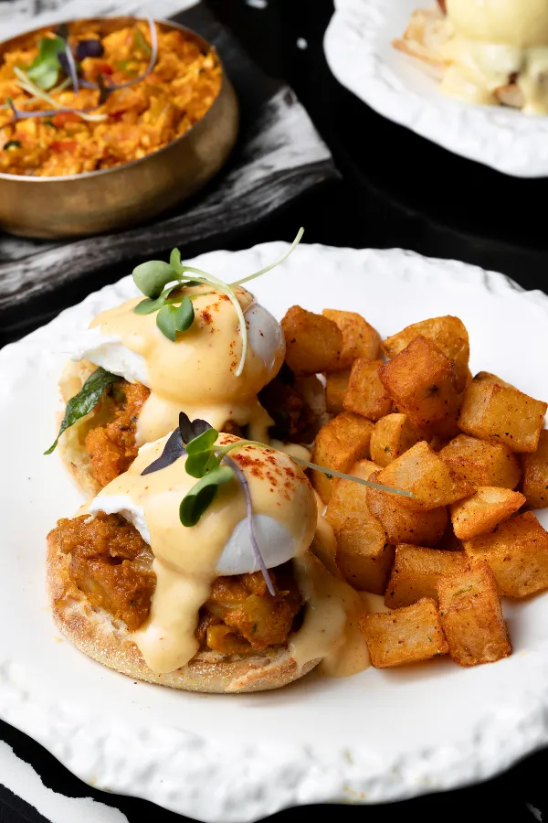 Malabar Shrimp Benny, Vancouver Brunch | Sula Indian Restaurant Malabar shrimp eggs benedict at Sula weekend brunch on Main Street in Vancouver