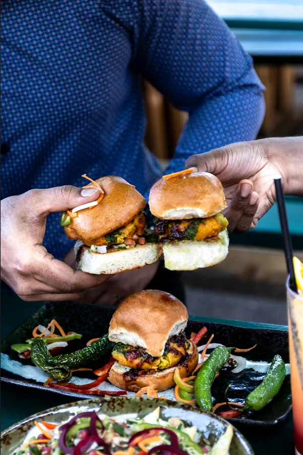 Sharing Indian sliders and cocktails at Sula happy hour, Vancouver
