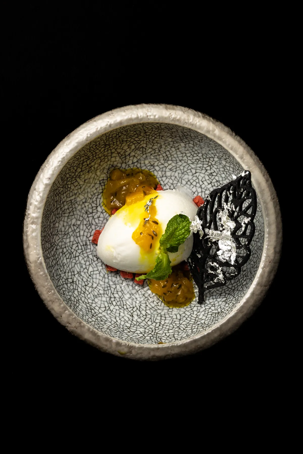 Coconut Pineapple Panna Cotta, the Tamil Nadu course that closes the tasting menu, with tropical compote, silver leaf and a dark tuile.